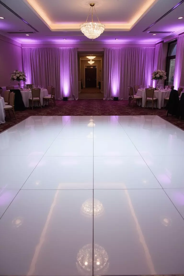 White Dance Floor A professional photo, similar to a photo in a wedding magazine, of a glossy white dance floor in the center of a reception hall, reflecting the ambient lighting and ready for dancing.