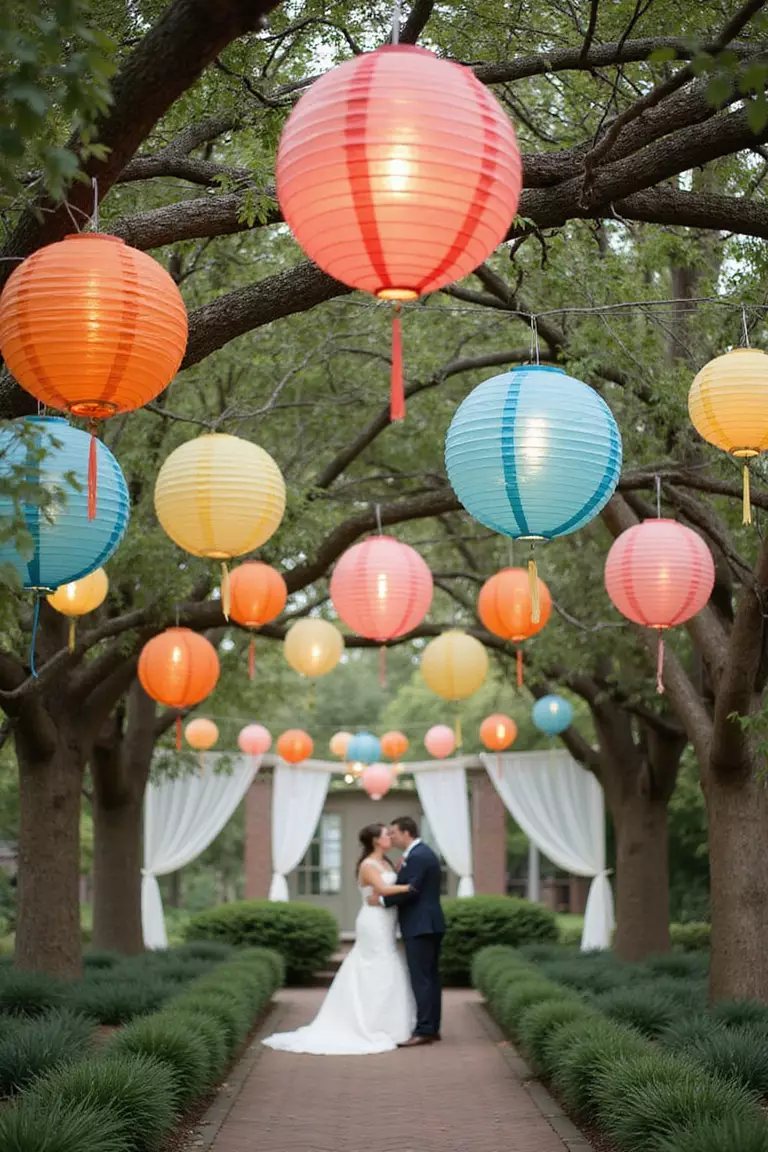 Paper Lanterns A professional photo, similar to a photo in a wedding magazine, of colorful paper lanterns hanging from tree branches above a garden wedding setting, creating a whimsical atmosphere.