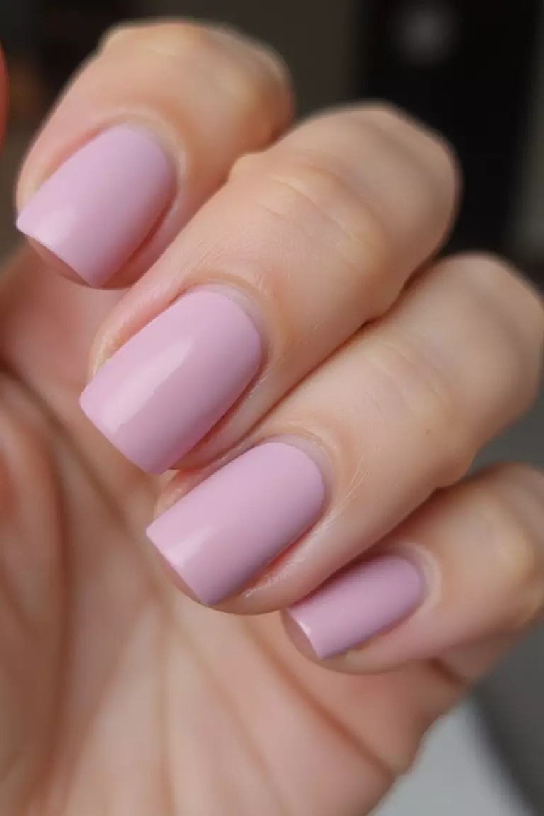 Dusty Pink Matte Close-up of a woman's hand with five fingers featuring dusty pink matte finish nails, velvet-like texture, no shine.