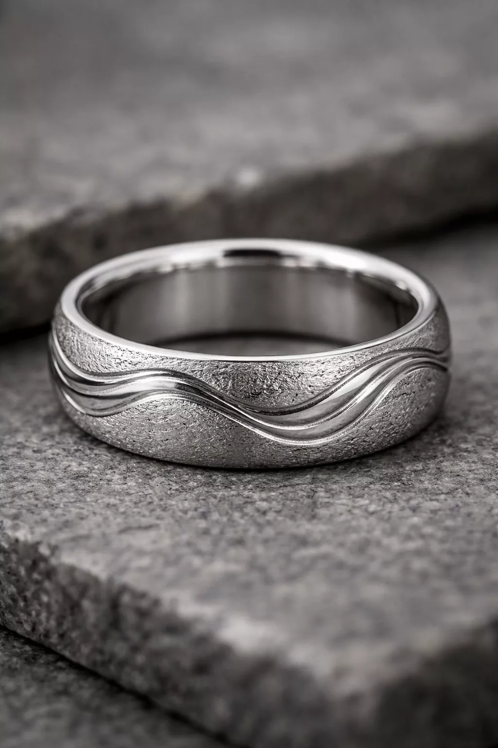 A realistic photo of a three dimensional platinum wedding band with an organic wave pattern and a textured metallic surface.
