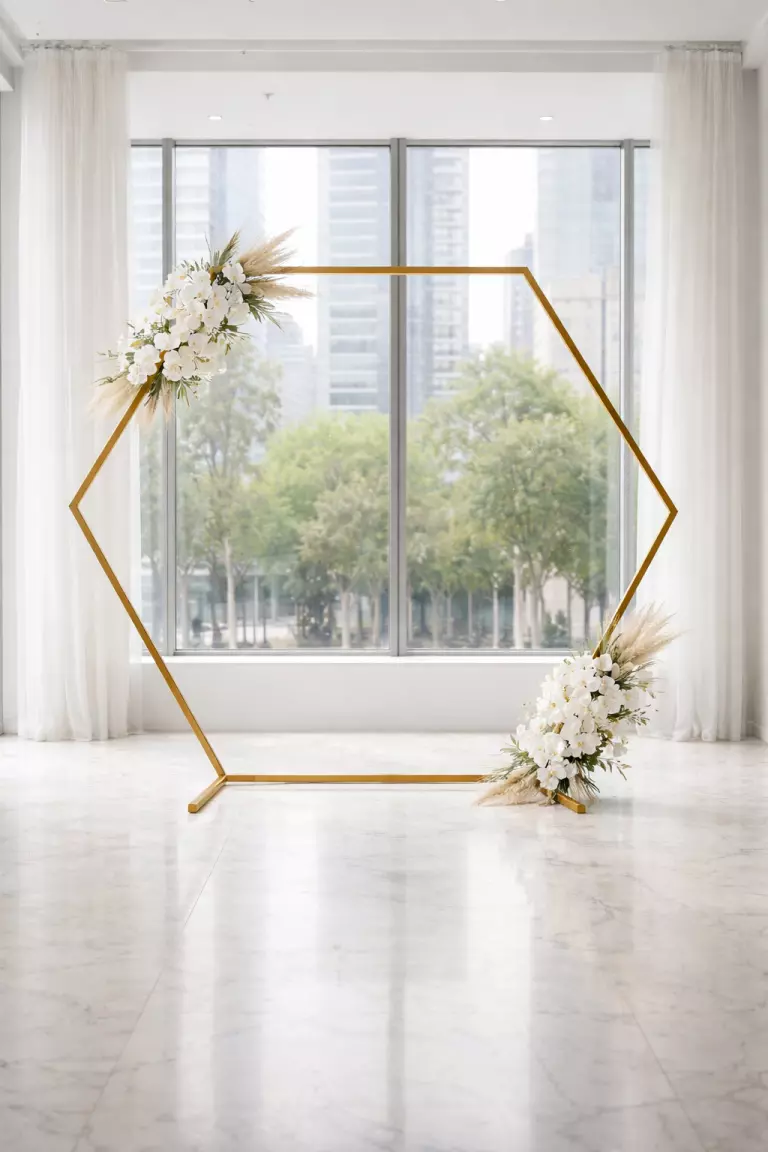 A realistic photo of a gold hexagonal metal wedding arch, a few white orchids placed at the corners, sleek and minimalist design in a high end urban gallery setting.