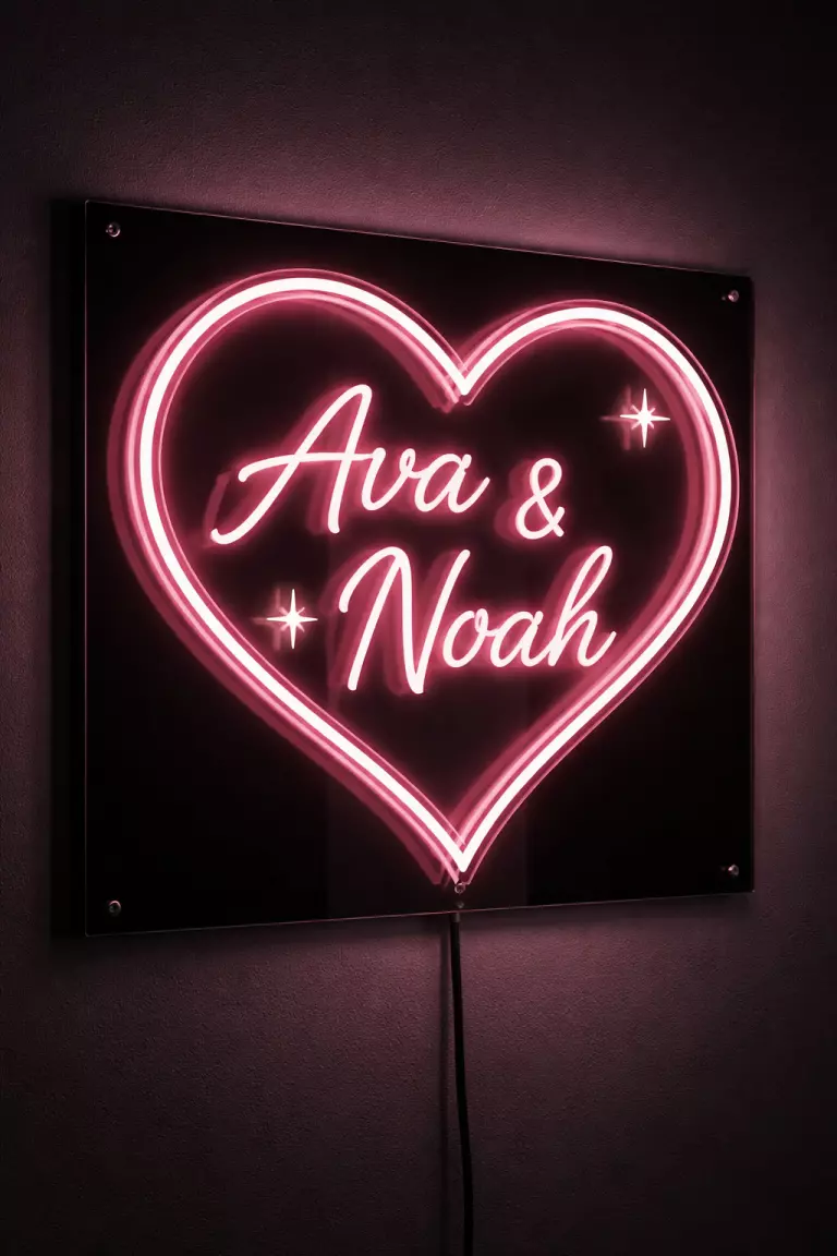 A realistic photo of a 3D neon sign shaped like a heart with a couple's names in a soft pink glow, mounted on a sleek black acrylic panel.