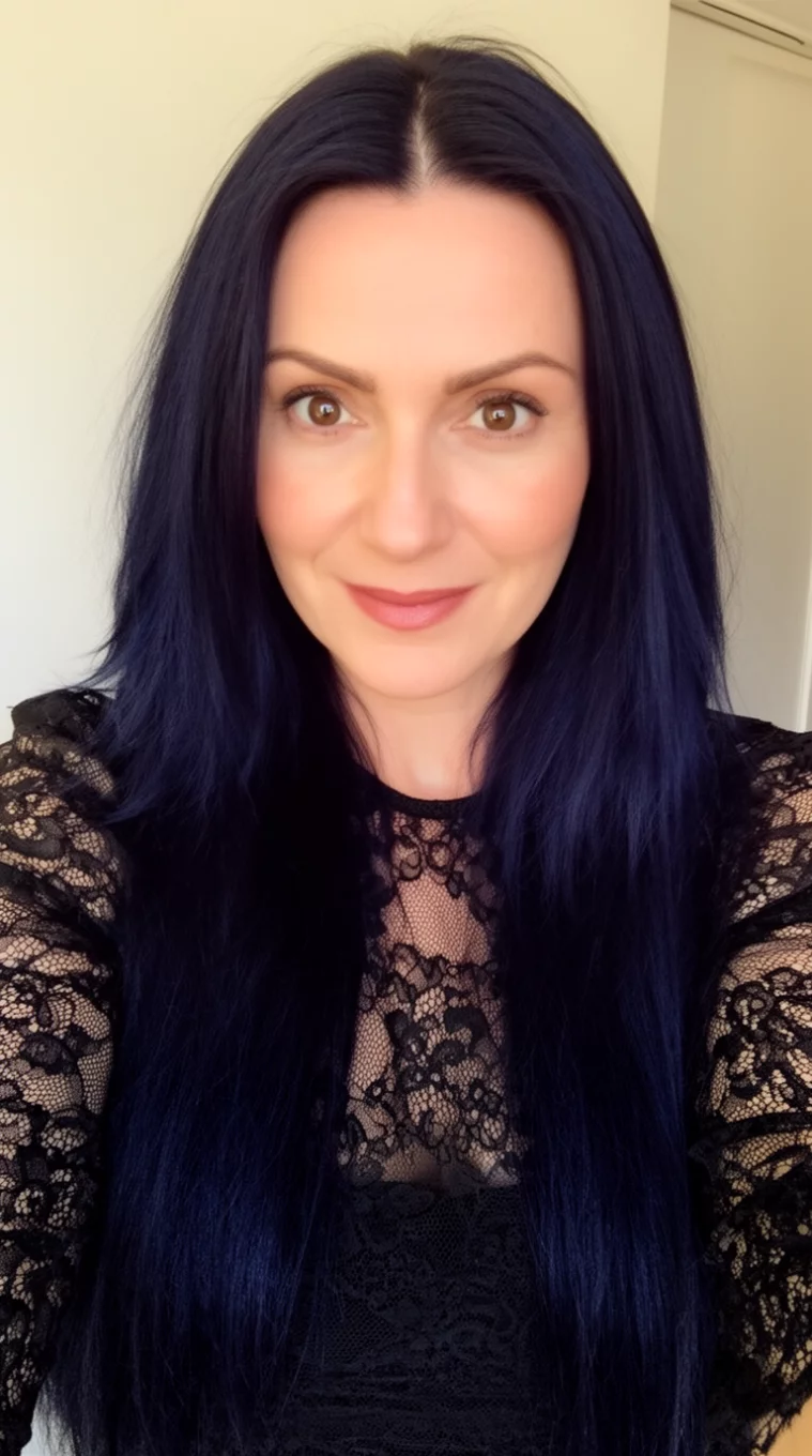 selfie of a 35-year-old woman wearing a black lace top with a Midnight Raven colored long hairstyle, front view, minimal background