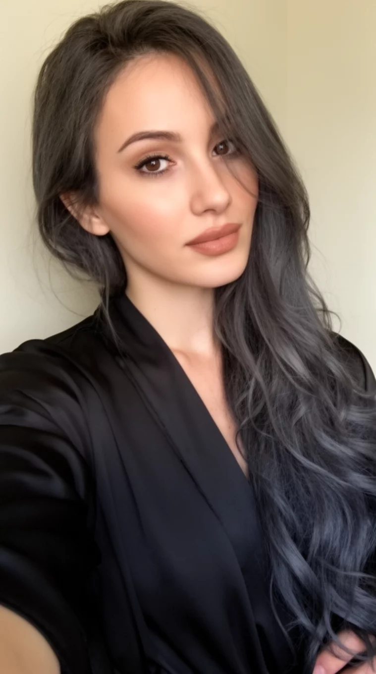 selfie of a 30-year-old woman wearing a black robe with a Sultry Dark Charcoal colored long hairstyle, side view, minimal background
