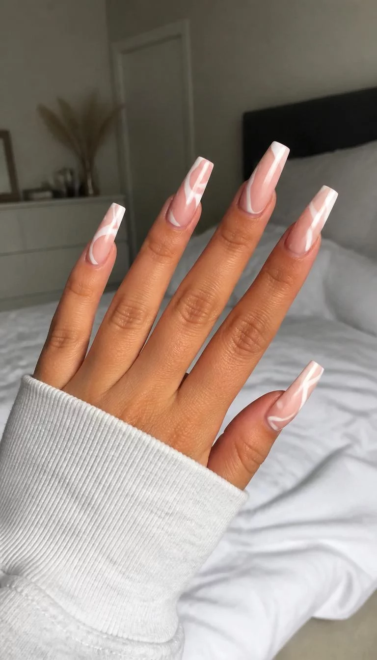 Abstract White Waves A photorealistic close-up shot of a woman's tan skin tone hand with five fingers, showcasing coffin-shaped very long nails featuring a subtle foundation and a striking white abstract wavy pattern, bedroom background