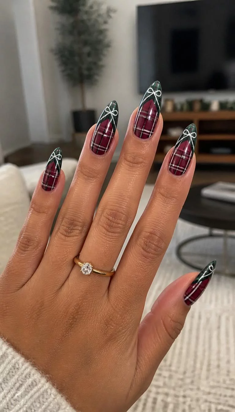 Long Bow Tie Elegance A photorealistic close-up shot of a woman's olive skin tone hand with five fingers, showcasing pointed long nails featuring a dark red plaid design and a green plaid French tip with white bows, living room background