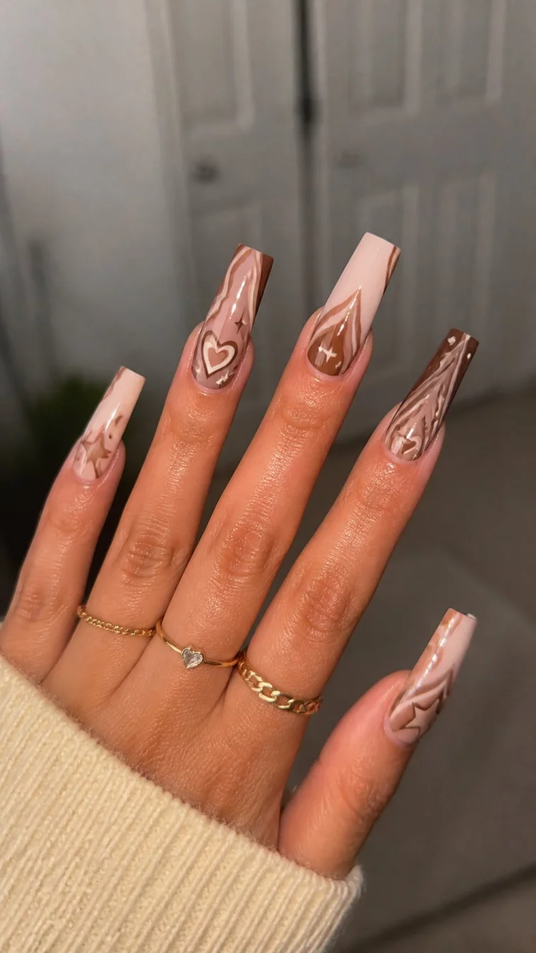 A photorealistic close-up shot of a woman's medium skin tone hand with five fingers, showcasing square-shaped extremely long nails featuring detailed earthy brown designs with small stars, hearts, and abstract wavy lines, indoor background